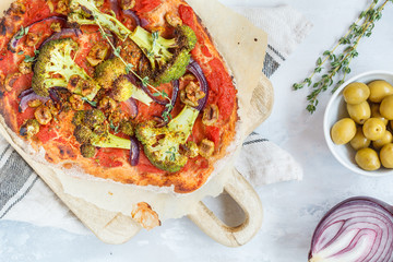 Homemade vegetable vegan pizza with broccoli and olives