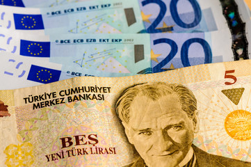 Turkish 5 Lira bank note against a number of Euro notes
