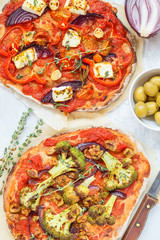 Homemade vegetarian vegetable pizza with feta cheese and broccoli.