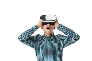 Young boy in virtual reality goggles on white background