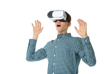 Young boy in virtual reality goggles on white background