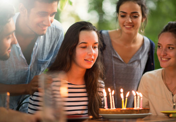 group of students celebrating a friend's birthday outside
