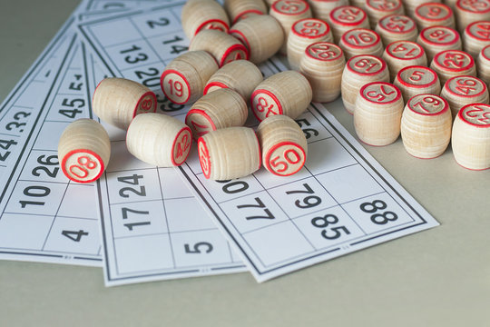 Wooden kegs and cards for a game in a lotto.