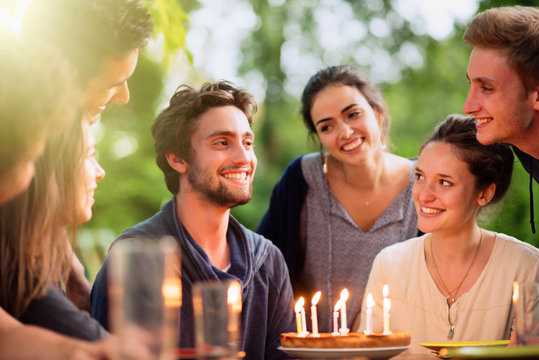  Group Of Students Celebrating A Friend's Birthday Outside