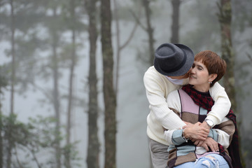 Portrait of happy romantic senior couple outdoors