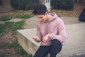 young male student with a smartphone