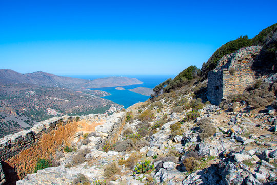 Panoramic view of the gulf of Mirambello with Spinalonga island. View from the mountain of Oxa with ruins of ancient water tanks, Crete, Greece.