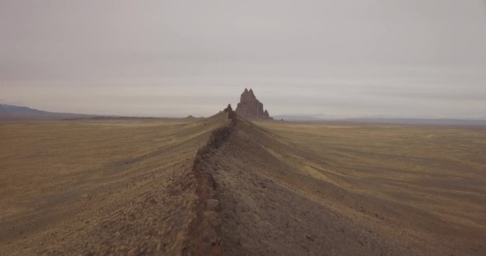 Flying along the ridge-line of ancient rock formations in the desert