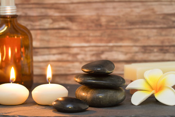 Obraz na płótnie Canvas wellness and spa composition candles with massage stones