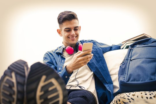 young with mobile phone listening to music
