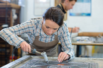 Woman working with stained glass