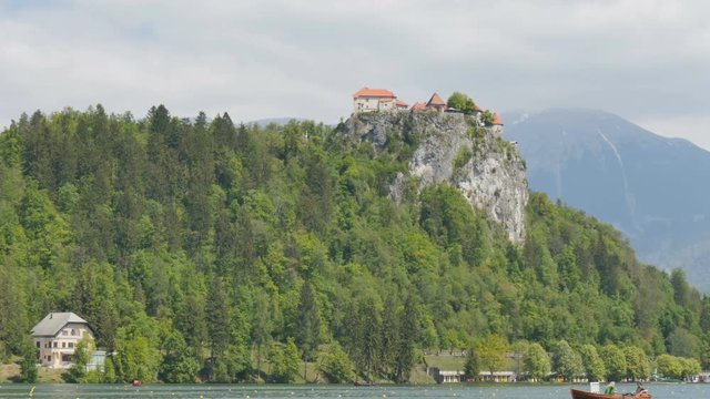 Bled castle Hyperlapse 4K UHD. Bled Lake its castle and island with church is a Slovenia Alps iconic touristic place where tourists can rowing, boating, camping and relaxing. Bled 1 May 2017.