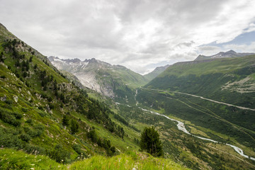 Fototapeta na wymiar road by Furka pass in Alps in Switzerland