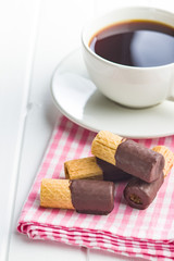 Sweet dessert. Biscuits rolls with chocolate icing.