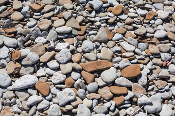 Sea pebbles. Small stones gravel texture background. Pile of pebbles. Colored stone in background