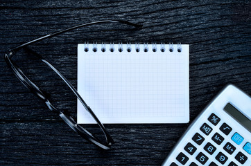 black eye glasses on table