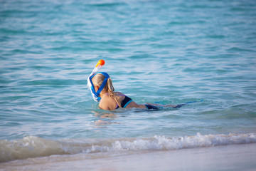 A young woman go snorkeling in the ocean
