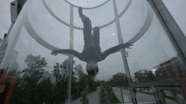 Flight skydiver training in wind tunnel. Training flight in a wind tunnel