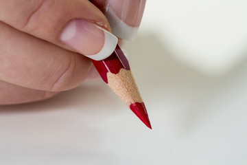 hand with red pencil
