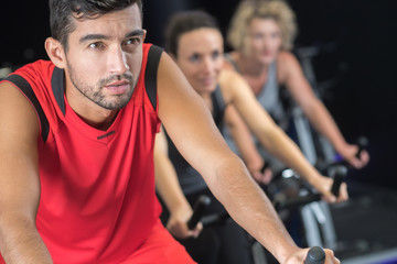 man in spinning class at a gym