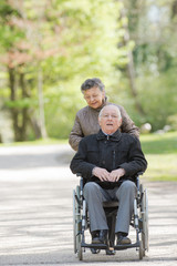 Fototapeta na wymiar senior couple in wheelchair