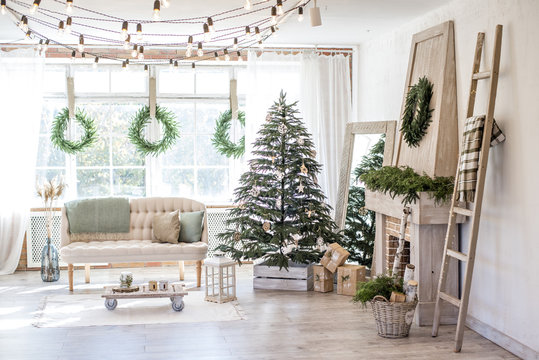 New Year and Christmas 2018. Beautiful, bright, spacious, decorated, Christmas apartment with a fireplace, a large beautiful tree and a huge window.