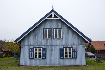 small wooden house in a beautiful village