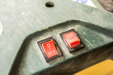 Close-up of two small switches on and off