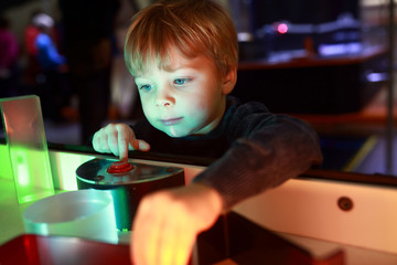 Child playing with refraction of light