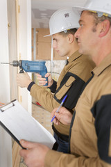 craftsman watching over his apprentice