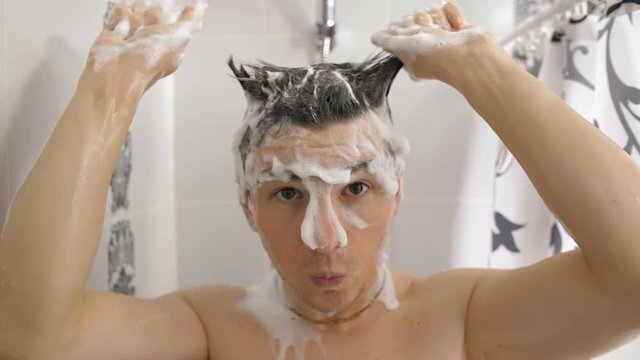 Funny Man With Good Mood Taking a Shower
