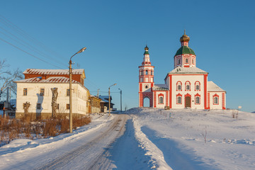 Winter landscape in the early frosty morning in Suzdal with an ancient temple. St. Elijah's Church