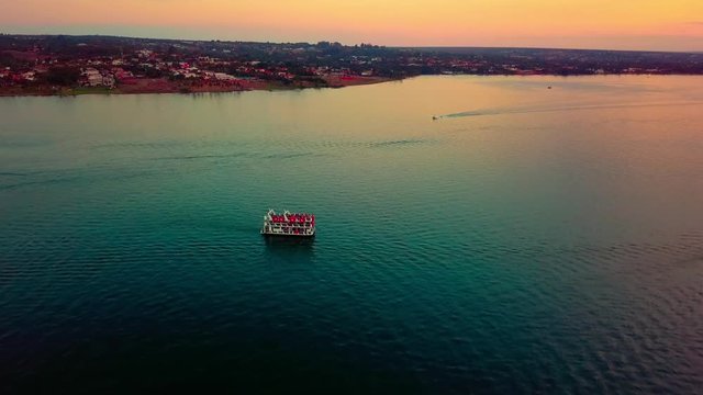 Aerial shot rising up above Lake Paranoa at dusk