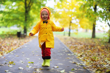 Children in the autumn park walk