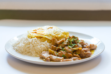 Thai food, Garlic Pork with steam rice and fried egg 
