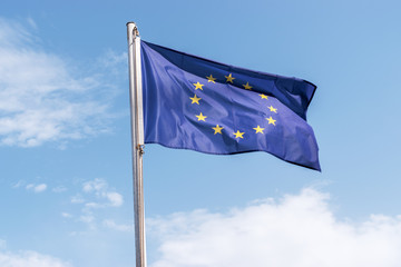 European Union flag on blue sky background