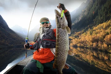 Deurstickers Fishing. Fisherman and trophy Pike. © vitaliy_melnik