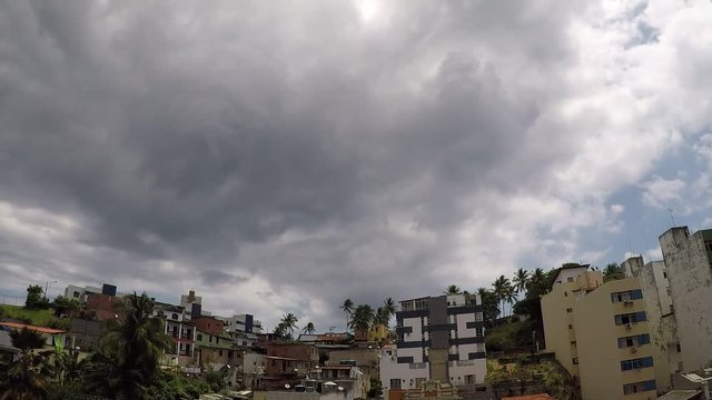 Time lapse with clouds moving over houses