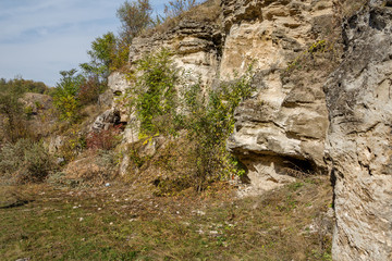 Old abandoned entrance to the underground quarry. Entrance to the catacombs of Odessa, Ukraine. As a creative background for design