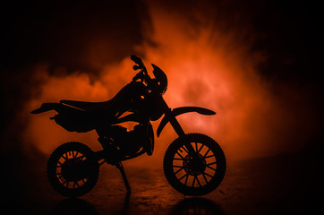 Fototapeta na wymiar High power motorcycle chopper. Fog with backlights on background with man rider at night