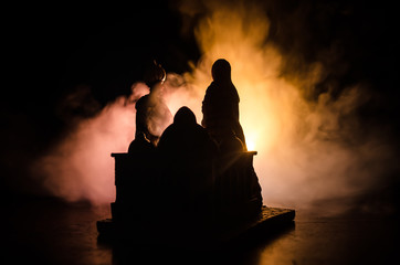 Silhouette romantic Scene of love muslim couples on dark cloudy toned background