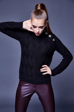 Beautiful sexy pretty woman perfect body shape face makeup wear black wool cashmere sweater and skinny lather pants sport shoes accessory casual clothes for party walk brunette hair fashion style.