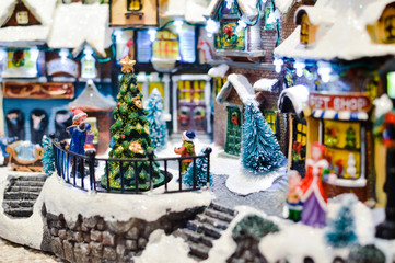 Decorated Christmas children shopping toys on joyful festive shiny blurred light background, closeup image. Seasonal elegant natural classy mood, love peace jolly decor design, traditional bright joy