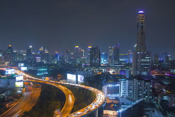 Fototapeta na wymiar Traffic in modern city at night, Bangkok Thailand