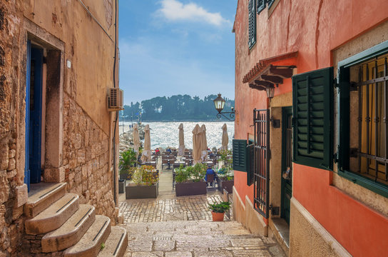 Romantic Rovinj street with a sea view.Idyllic street with old houses in town of Rovinj, Istria, Croatia