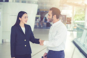 Handshake of businessman and businesswoman of business meeting, Partnership with agreement dealing...
