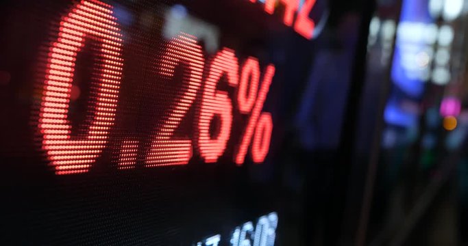 Stock market quotes with city scene reflect on glass