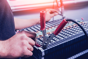 Charging the batteries of the elecric motor. Disassembling the battery of an electric vehicle engine