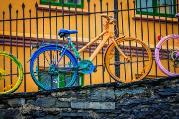 Old rusty colourfully painted vintage bicycle