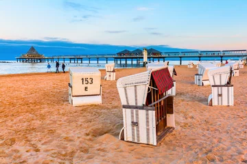 Papier Peint photo Heringsdorf, Allemagne pier of Heringsdorf, Germany, with hooded beach chairs